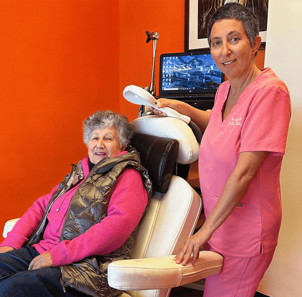 TMS treatment session showing magnetic stimulation device targeting the brain